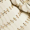Cream Paco shoulder clutch in calfskin leather