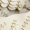 Cream Paco shoulder clutch in calfskin leather
