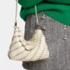 Cream Paco shoulder clutch in calfskin leather