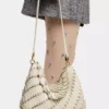 Cream Paco shoulder clutch in calfskin leather