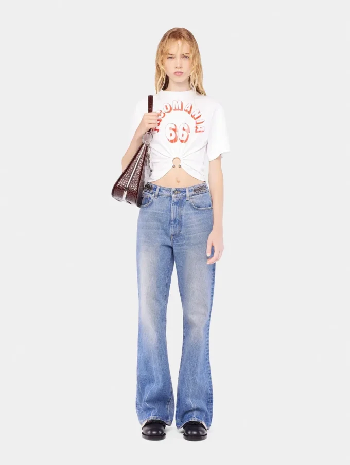 Flared jeans embellished with 1969 discs