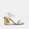 Gold sandals with Sparkle disc heels