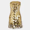 Gold short dress in assembly