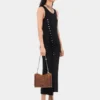 Sleeveless black drappé pression dress